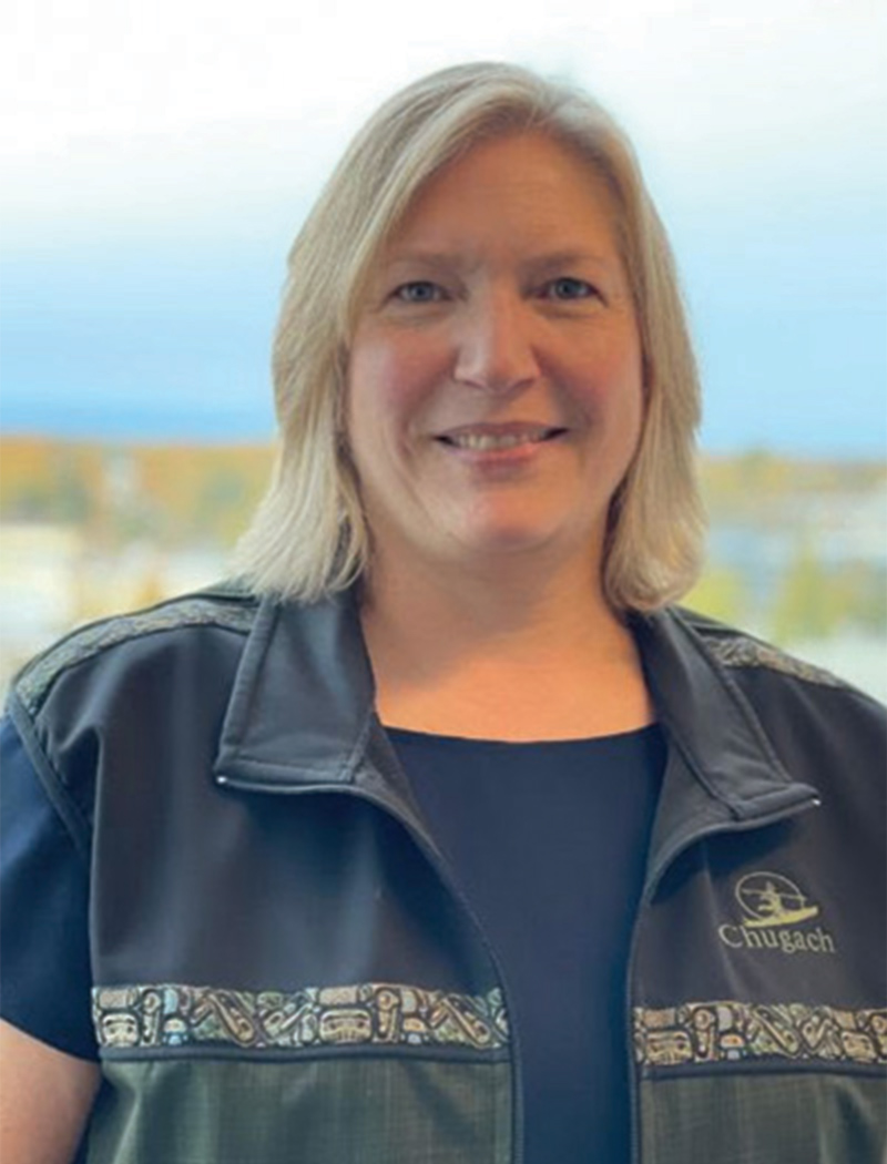 Headshot of a woman with short blonde hair, wearing a blue shirt, and jacket (Gwen Welch)
