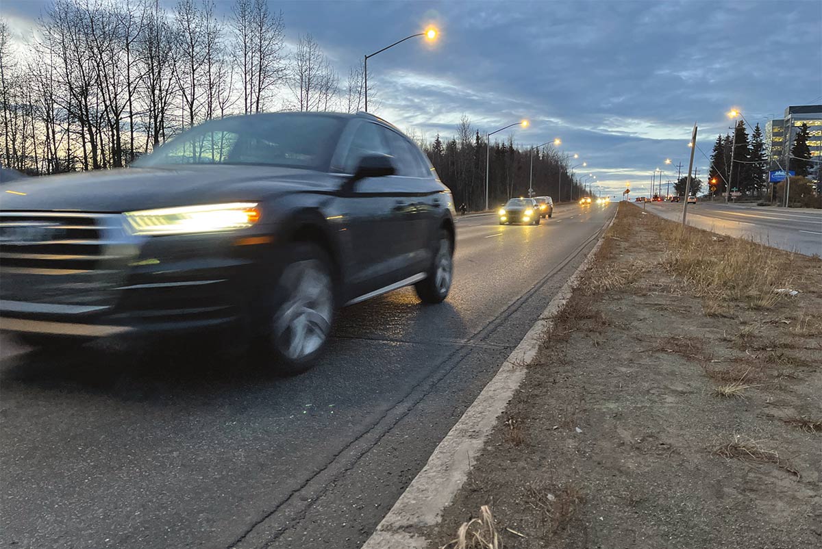 car zooming by on the road