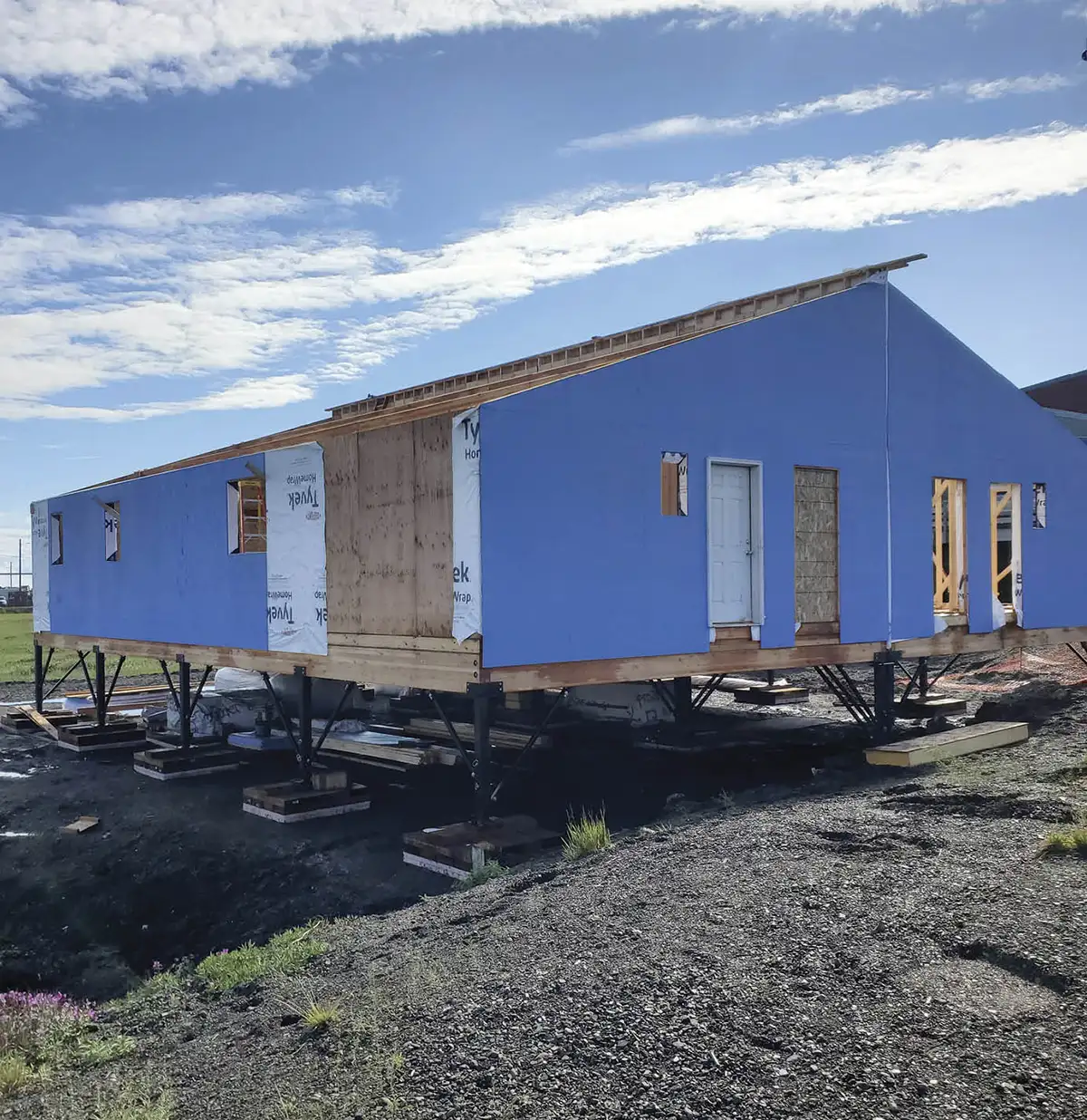 Construction progress on the first duplex prior to installation of the roof panels in July 2023.