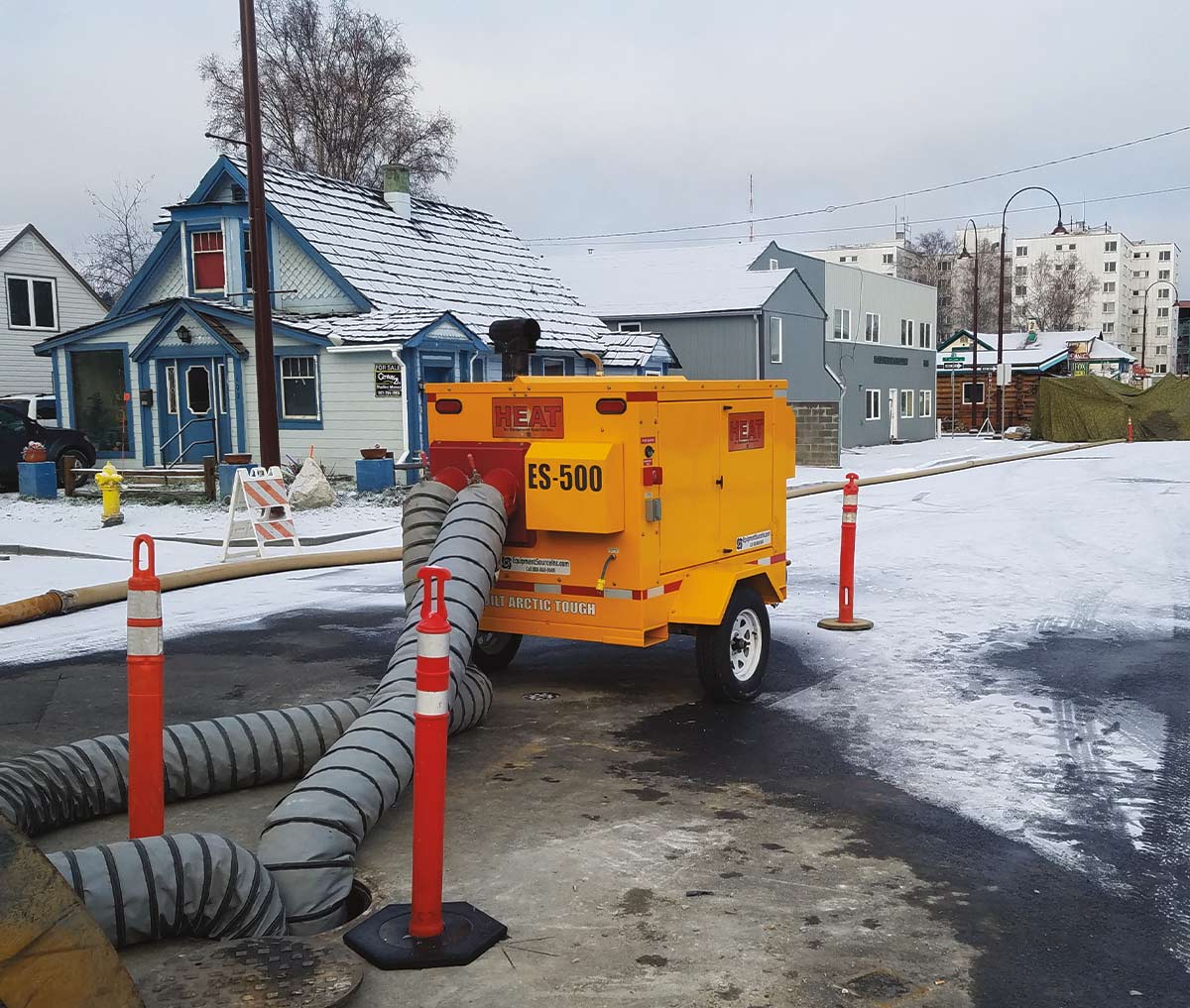 Equipment Source Inc. portable heater sitting outside in the snow