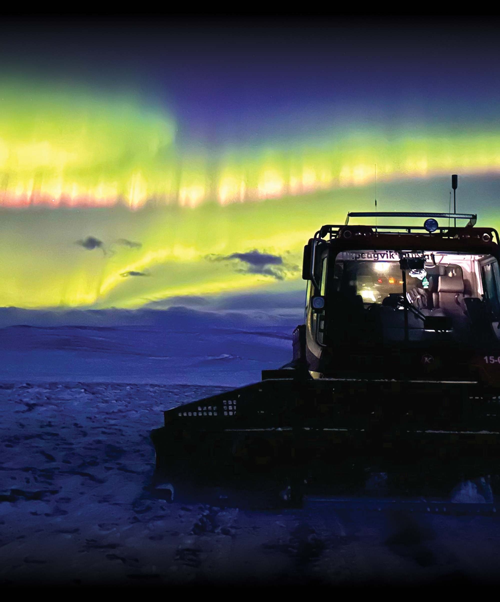 heavy equipment with the Aurora Borealis in the night sky