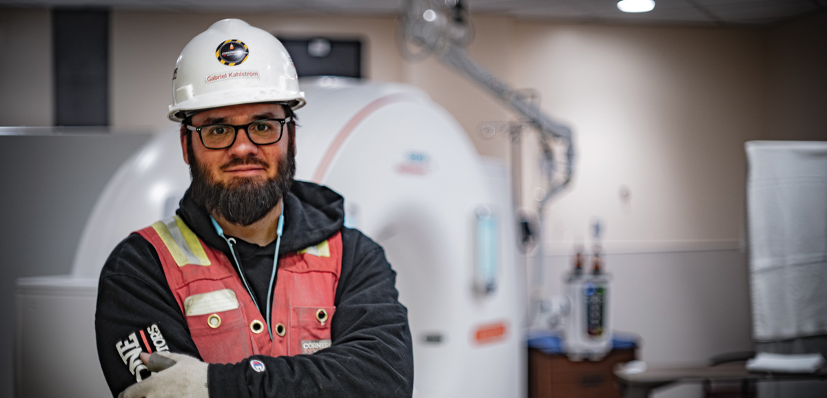 Gabriel Kahlstrom, superintendent at Cornerstone General Contractors, stands in front of a new MRI suite completed as part of the wider diagnostics upgrade project at Bartlett Regional Hospital in Juneau.