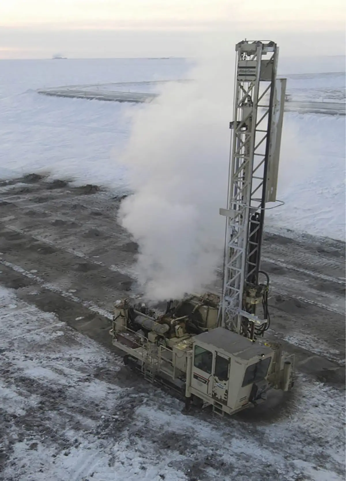 A Cruz Construction crew drills for a gravel shot in E pit at Prudhoe Bay