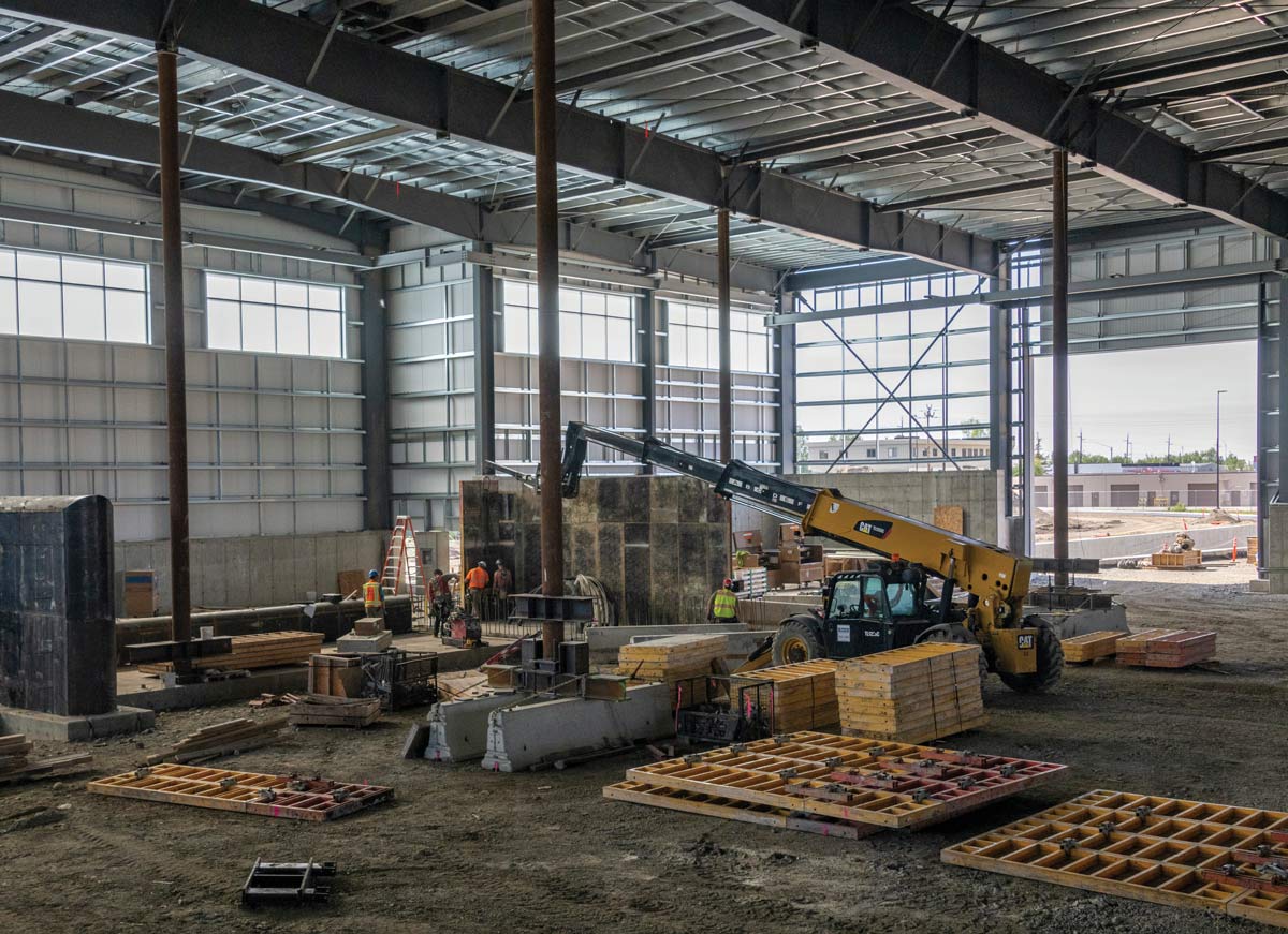 construction workers inside Anchorage's new Central Transfer Station