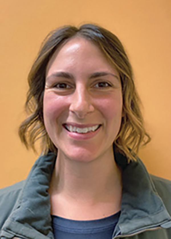 Portrait headshot photo of Amber Benham smiling