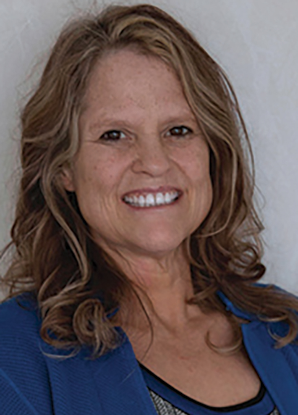 Portrait headshot photo of Carmen Randle smiling