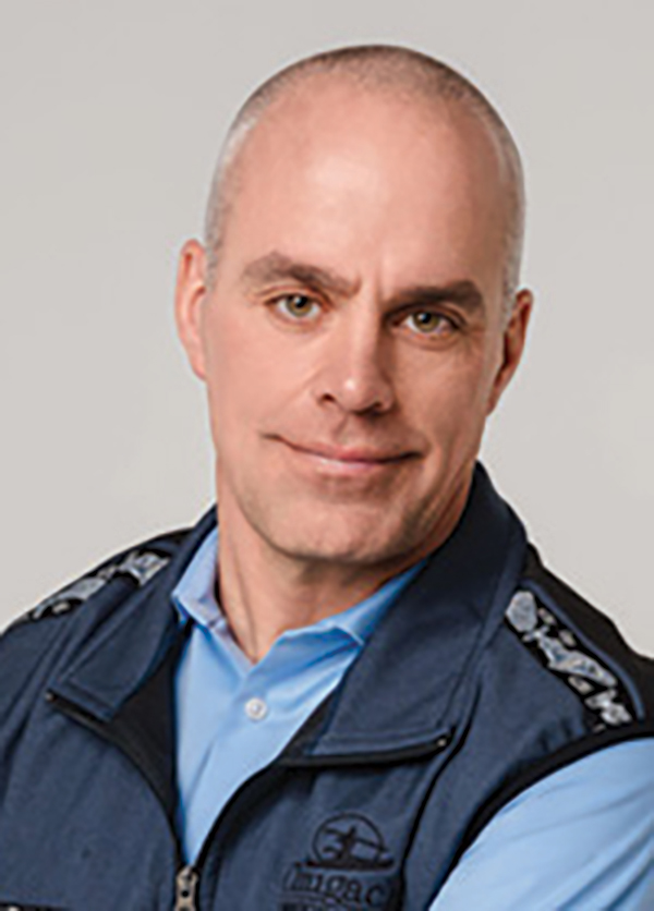 Portrait headshot photo of Shane Jolin grinning