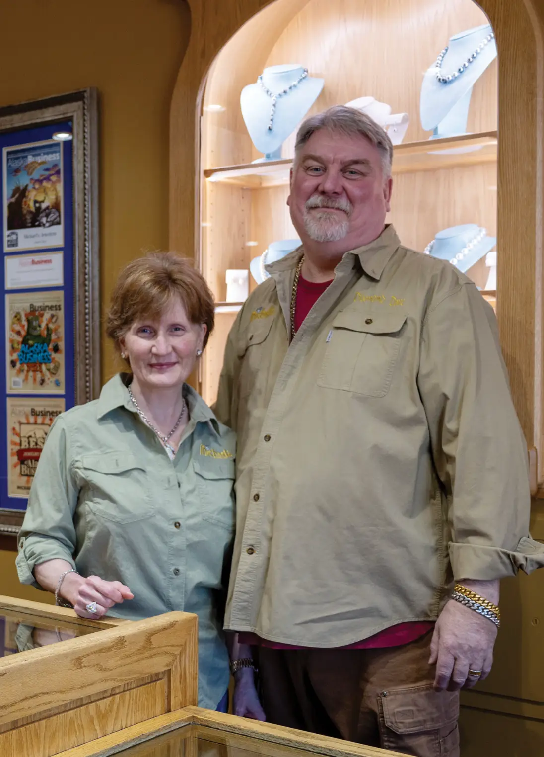 Man and woman posing in jewelry store