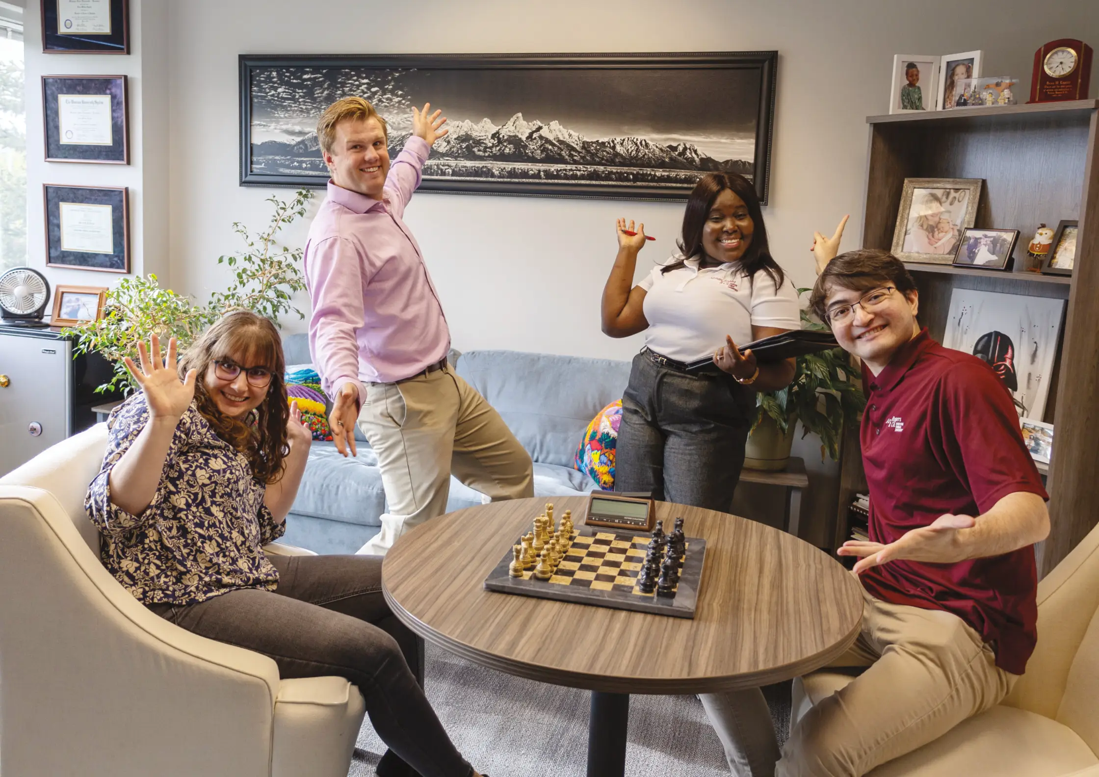 diverse group in funny poses in office