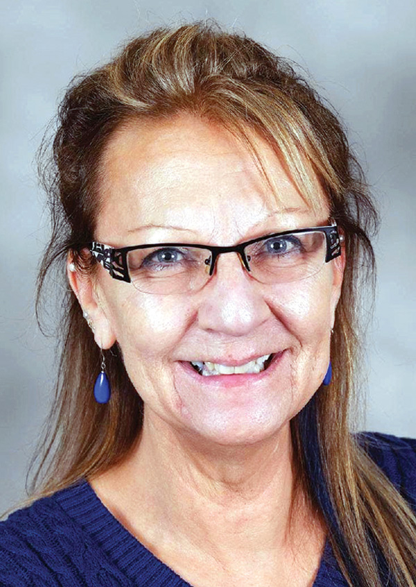 Portrait headshot photo of Judean Gordon smiling