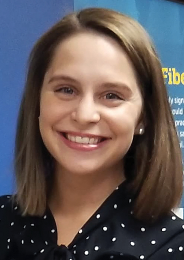 Portrait headshot photo of Kristin O'Lear smiling