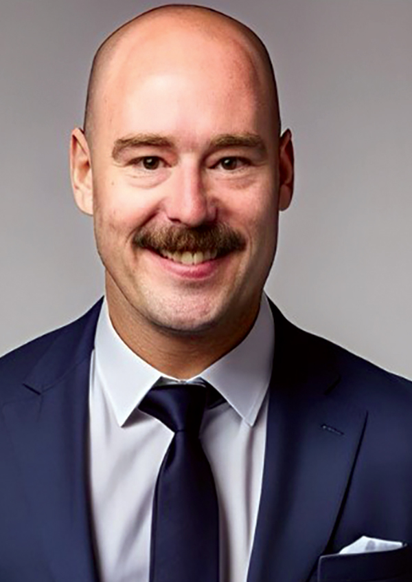 Portrait headshot photo of Steve Rader smiling