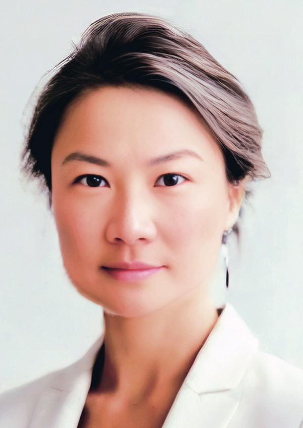 Portrait headshot photo of Wei Ying Wong grinning
