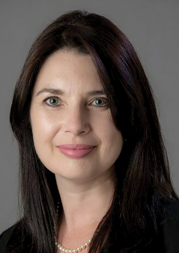 Portrait headshot photo of Abigail O'Connor grinning