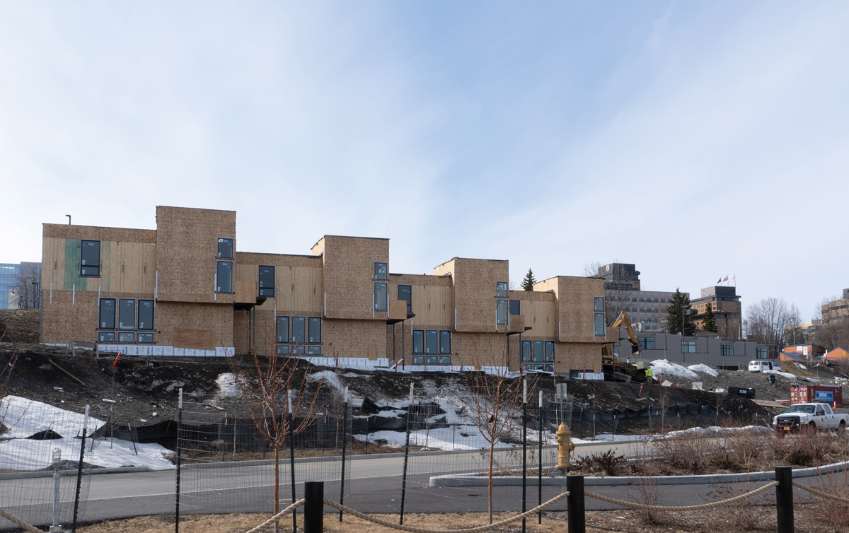 line of townhouses under construction overlooking Ship Creek in Downtown Anchorage