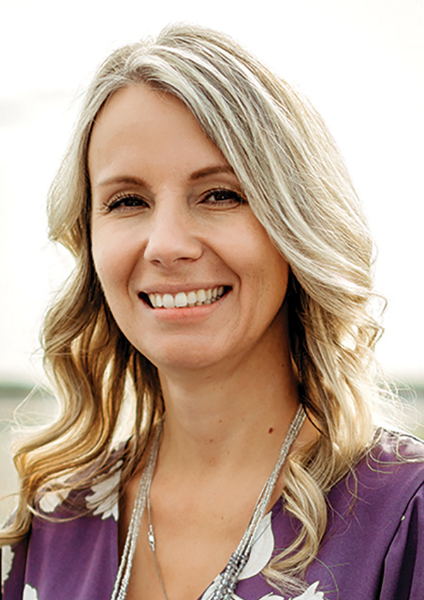 Portrait headshot photo of Angie Spear smiling
