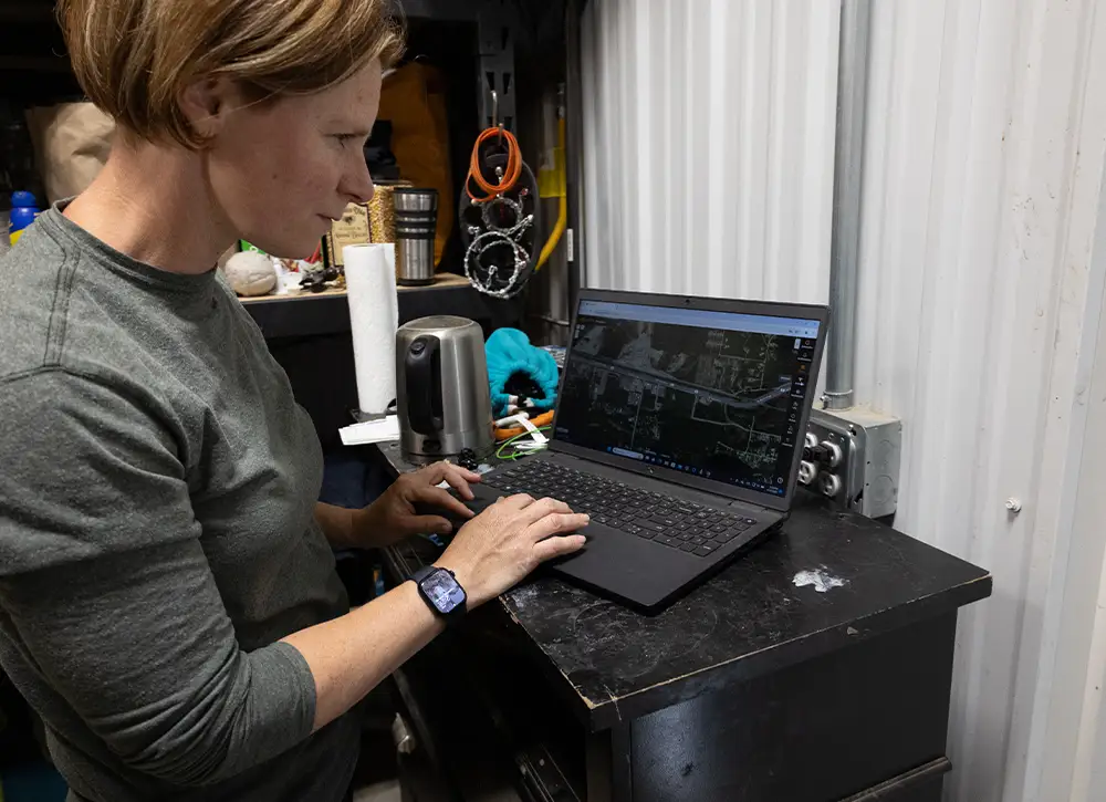 Julia Saunders demonstrates how the eShepherd program works on her laptop