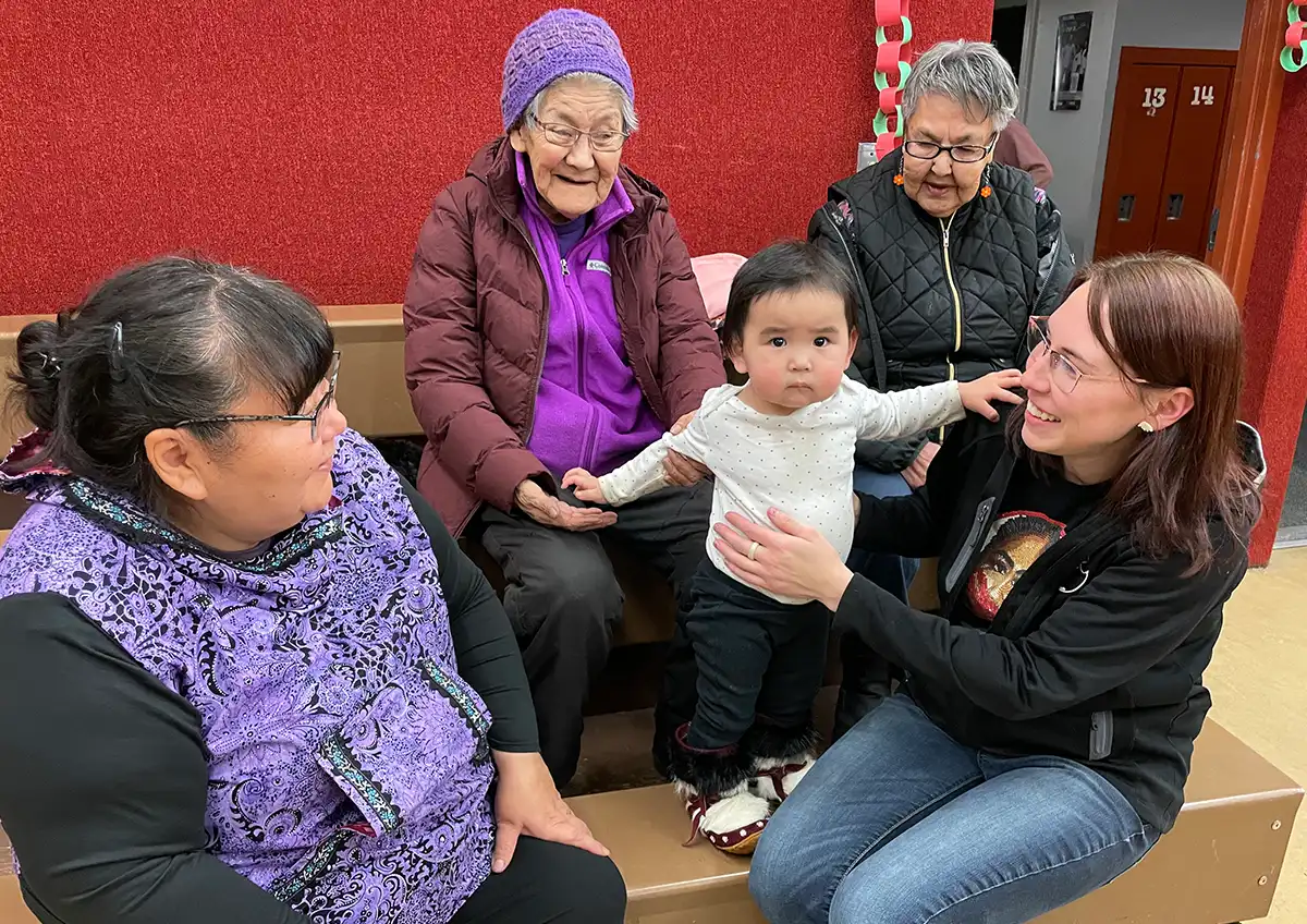 women sitting with a child