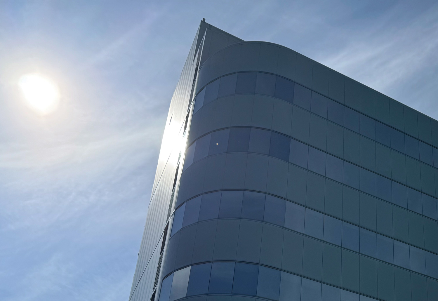 top of a building backlit by sunlight