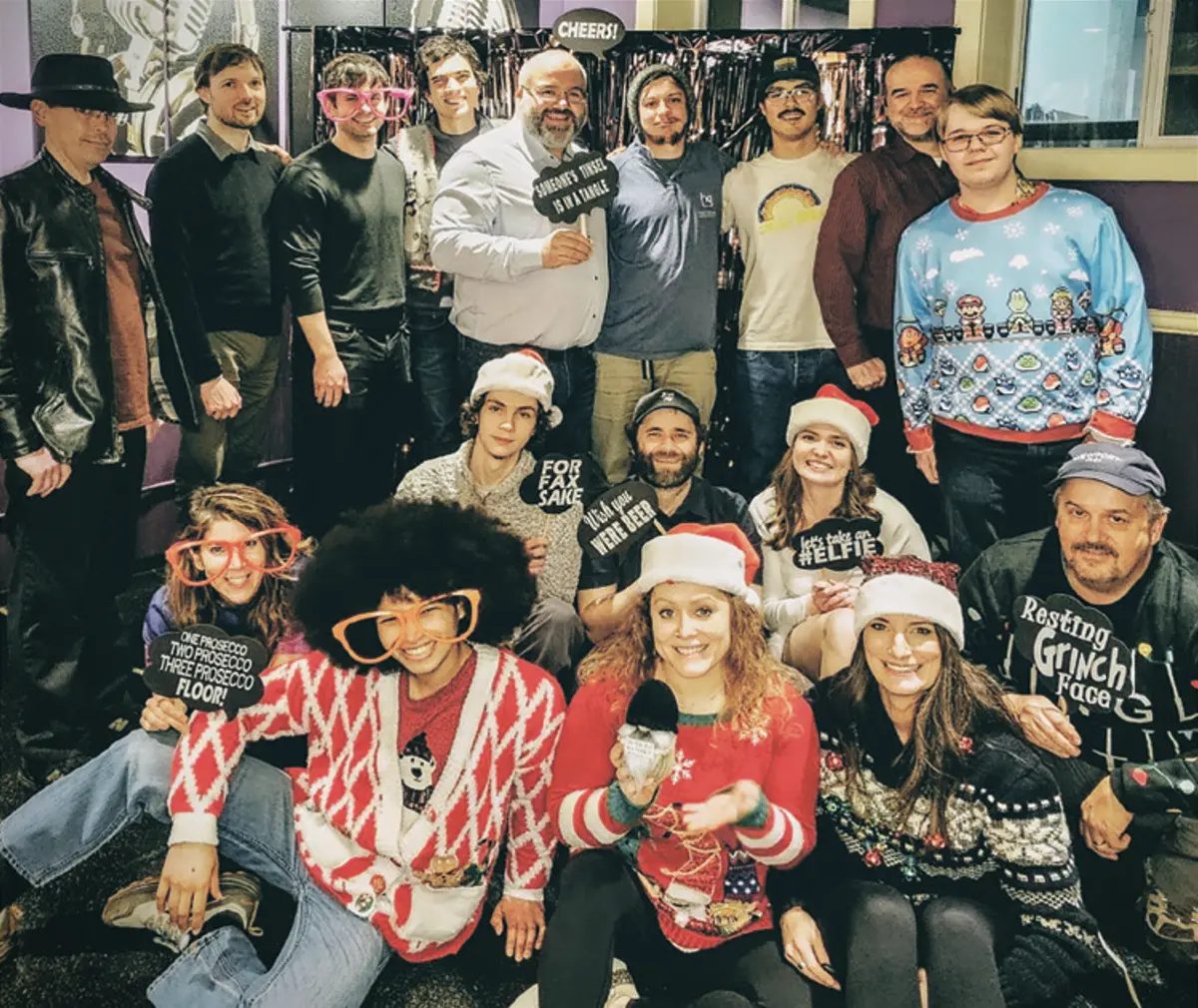 Hansen Gress team members bunch together for a playful holiday themed group photo