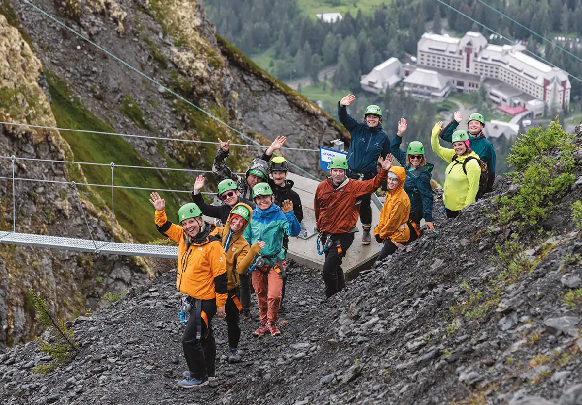 guests on the Veilbreaker Skybridges with Alyeska resort in the background