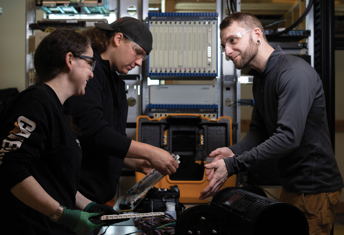 Students participating in electrical training with their instructor 