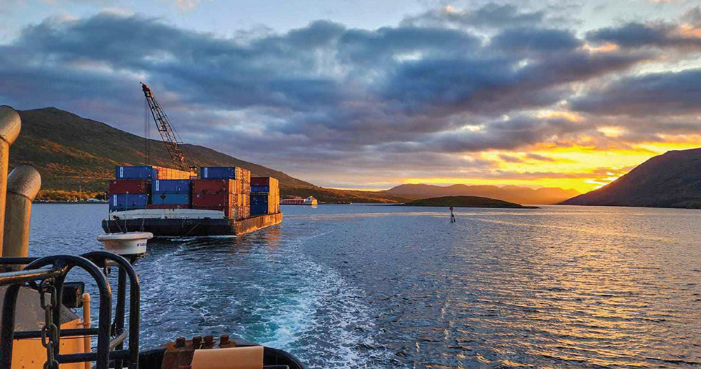 tug and barge out in Alaska during sunset