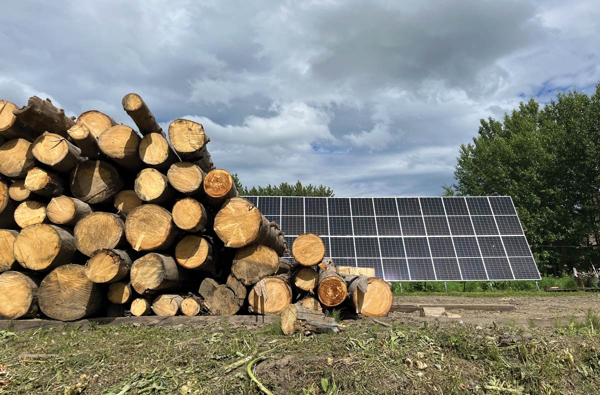 pile of lumber laying on grass 