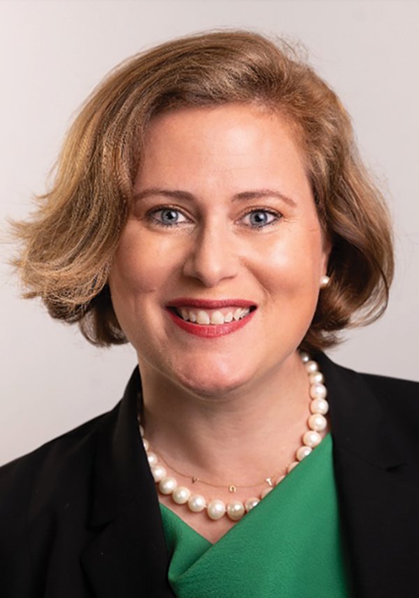 Portrait headshot photograph of Moira Smith smiling