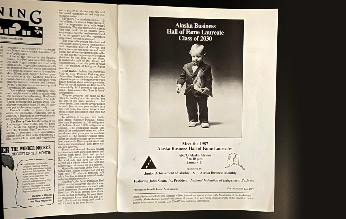Magazine pages featuring a toddler in a suit as "Alaska Business Hall of Fame Laureate Class of 2030."