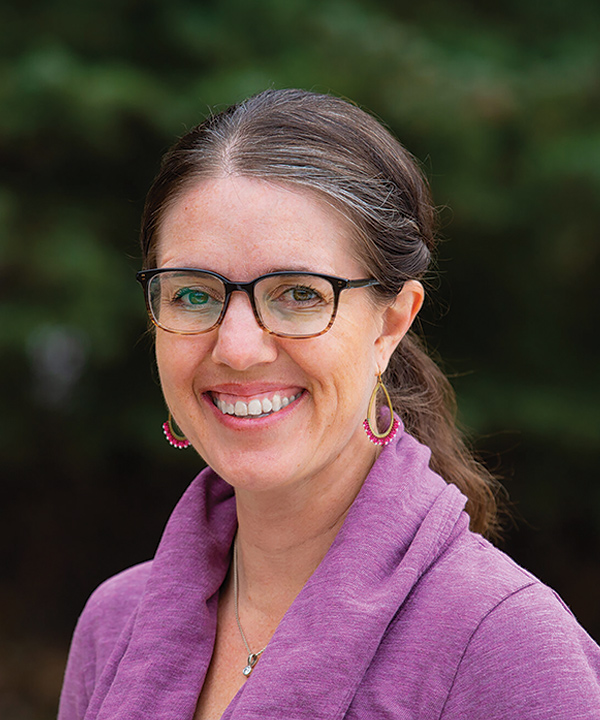 Portrait headshot photograph of Dr. Anne Zink smiling