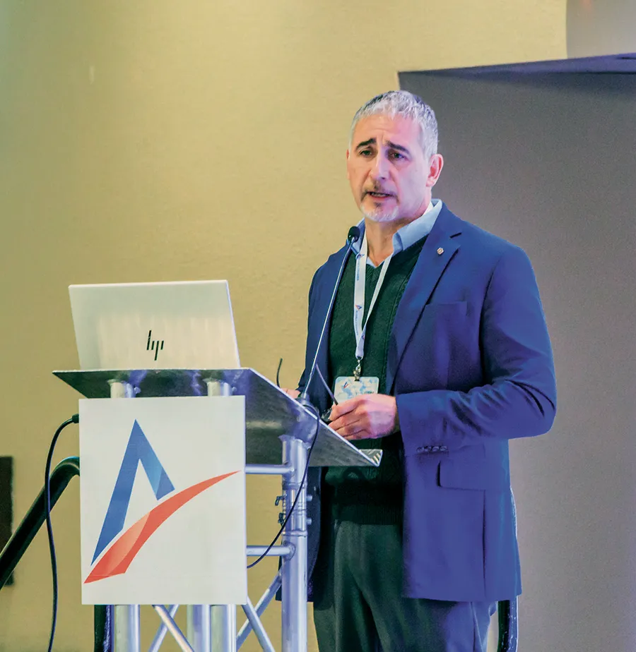 AI Resource Program Director Carlos Machuca giving a presentation at the Alaska Business Summit