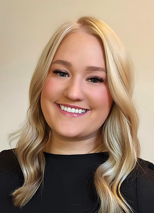 Portrait headshot photograph of Brianna Carlson smiling