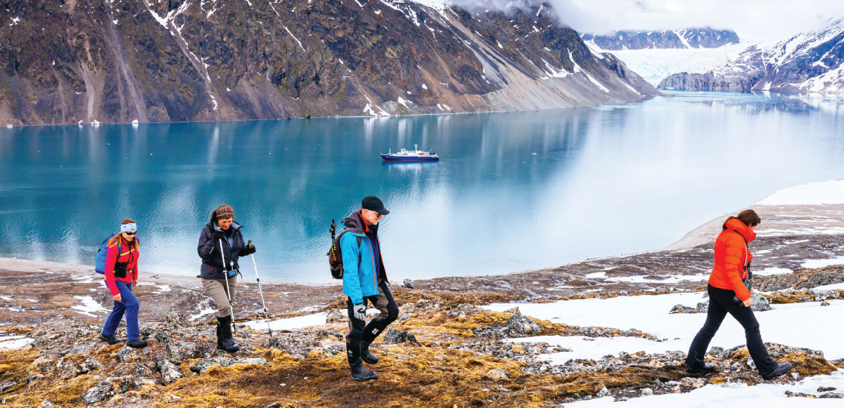Oceanwide Expeditions passengers walking along lake