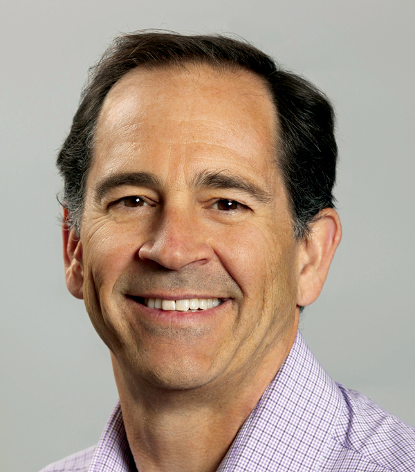 Portrait headshot photograph of Dempsey Thieman smiling