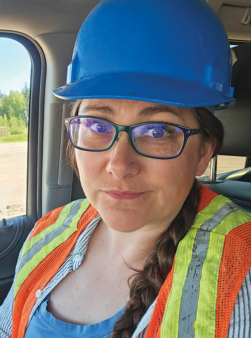 Portrait headshot photograph of Maggy Desmond-Layral grinning