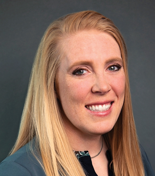Portrait headshot photograph of Nicole Boswell smiling