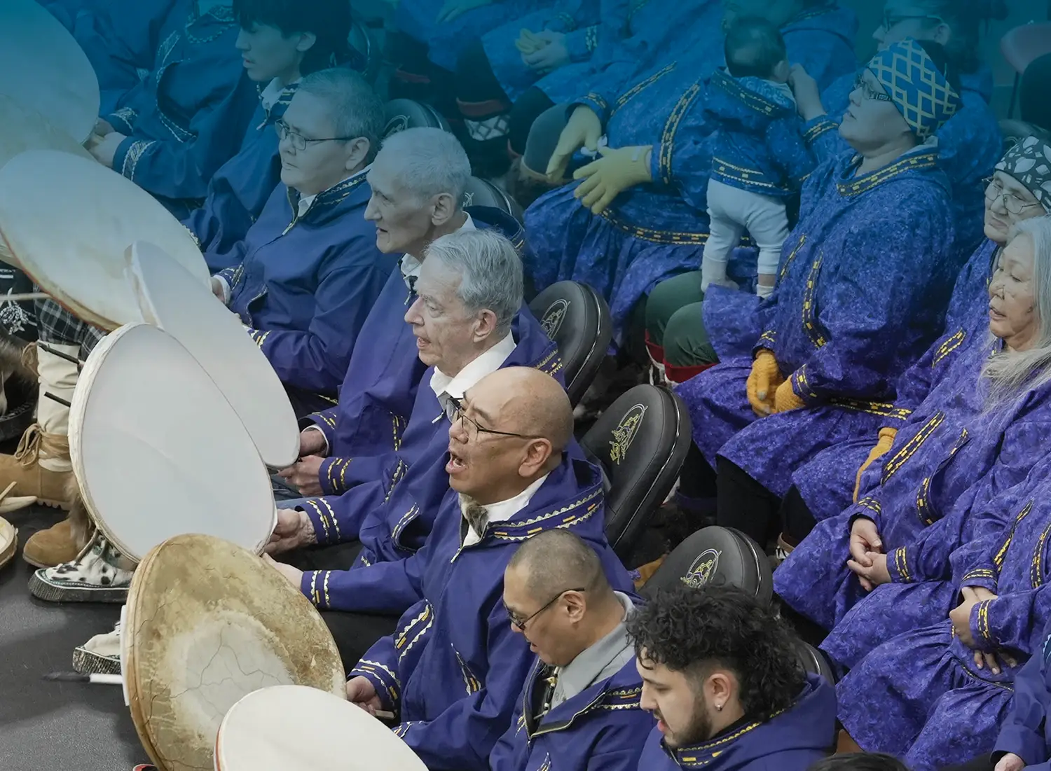 group of people wearing purple robes