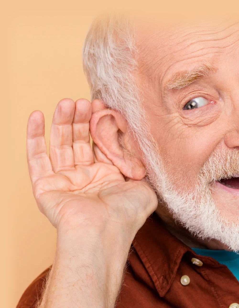 old man holding his hand up to his ear
