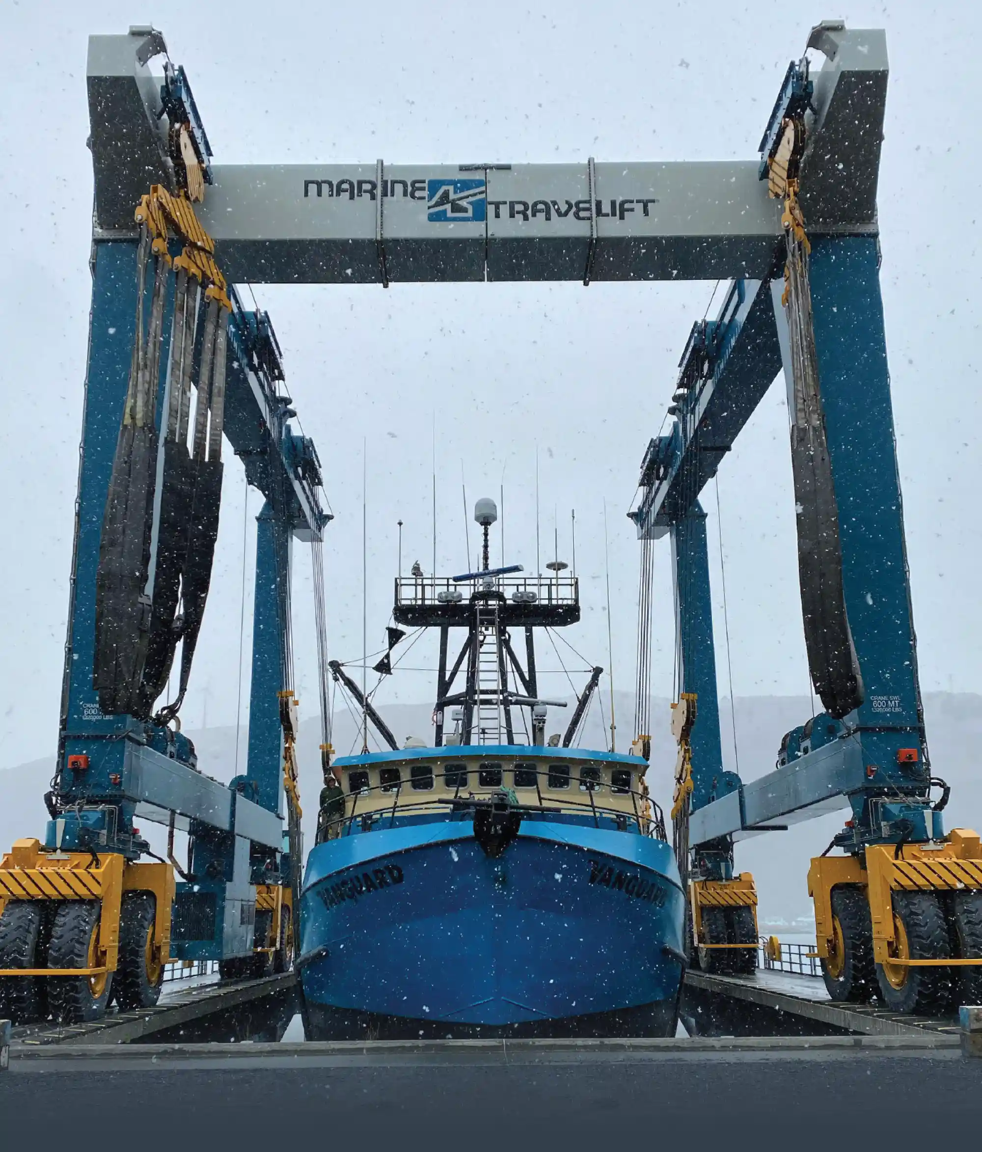 boat under a Marine Travelift machine