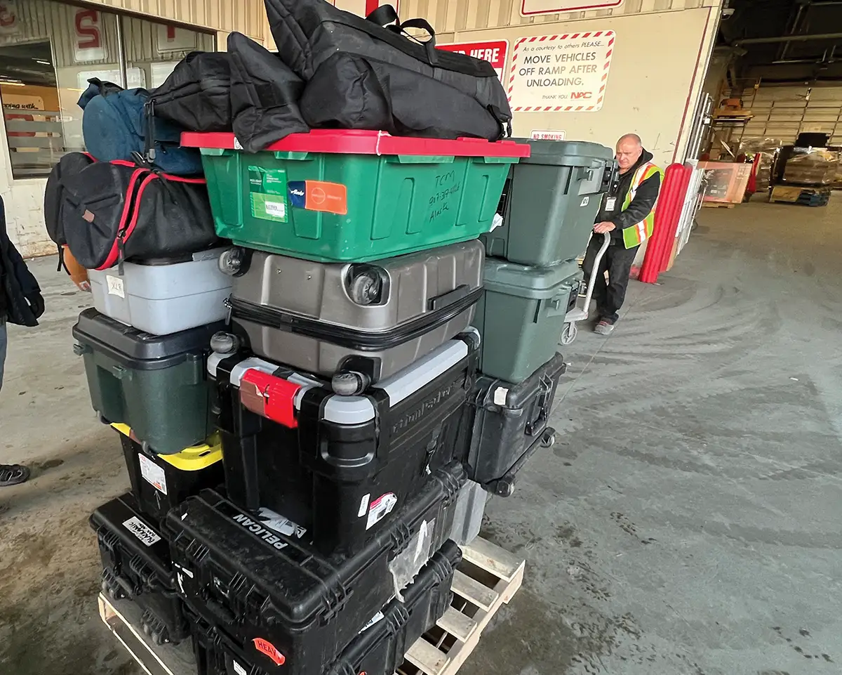 livestreaming equipment in stacked plastic containers