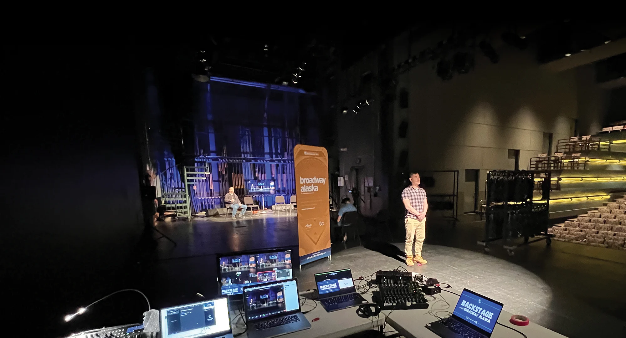 auditorium with computers set up on a table