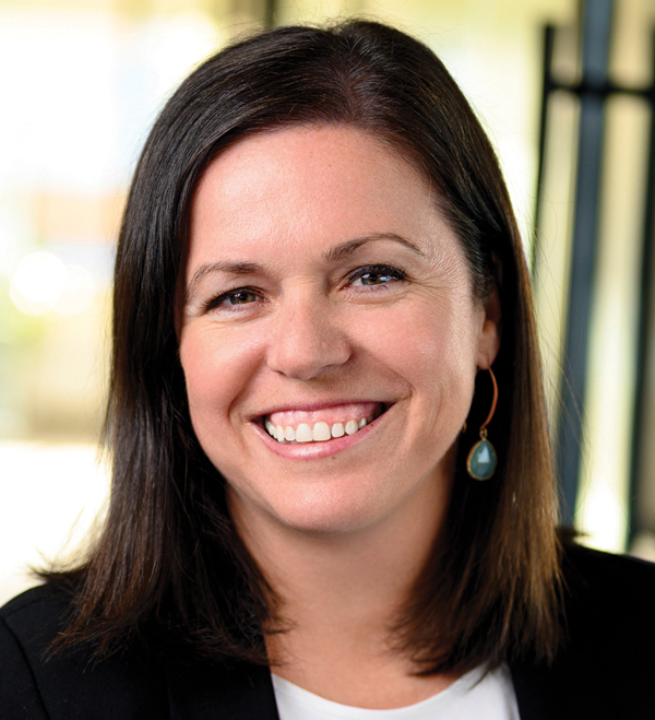 Portrait orientation close-up headshot photograph of Sarah Jane Shine smiling