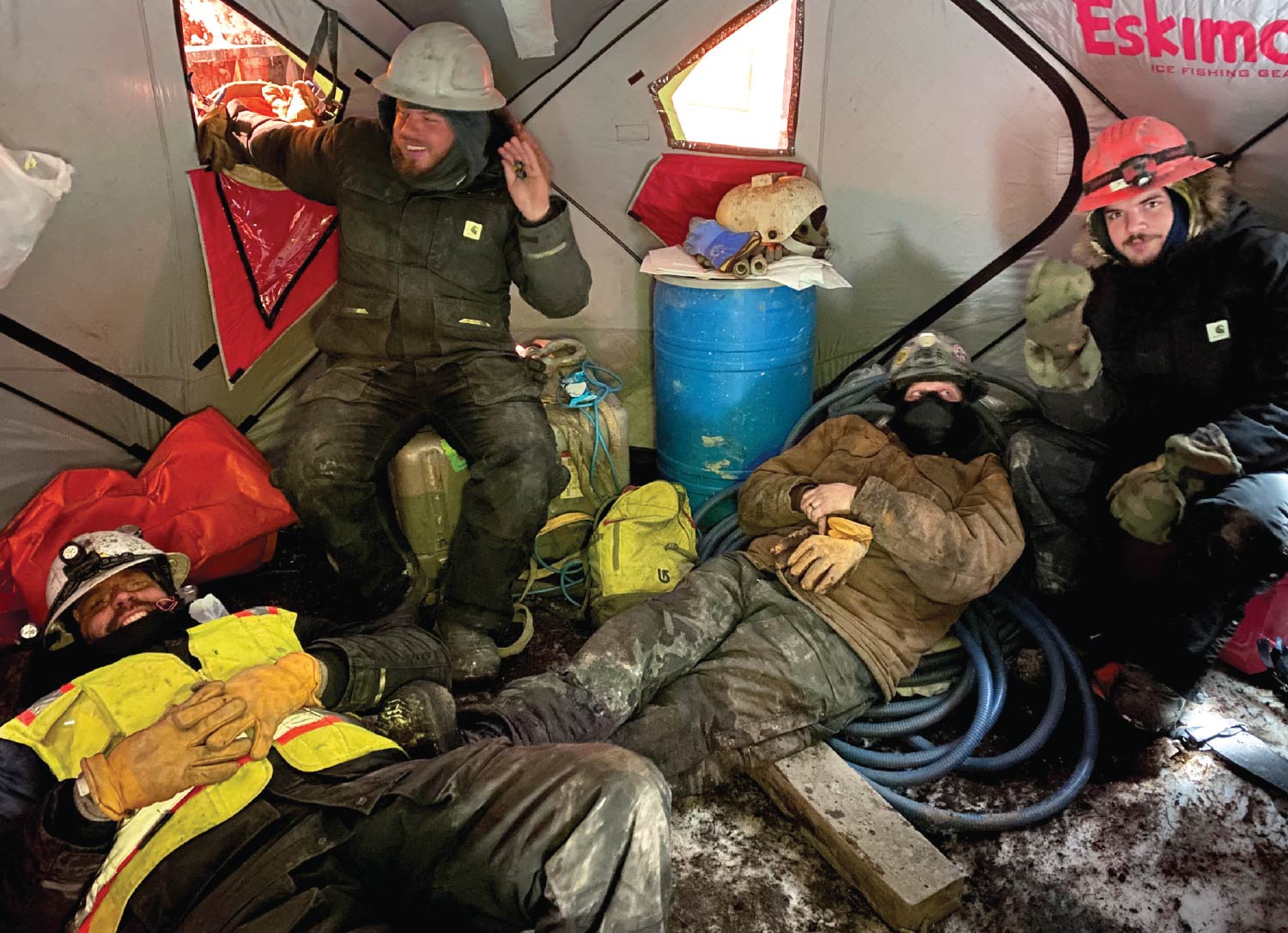working crew inside tent in uniforms