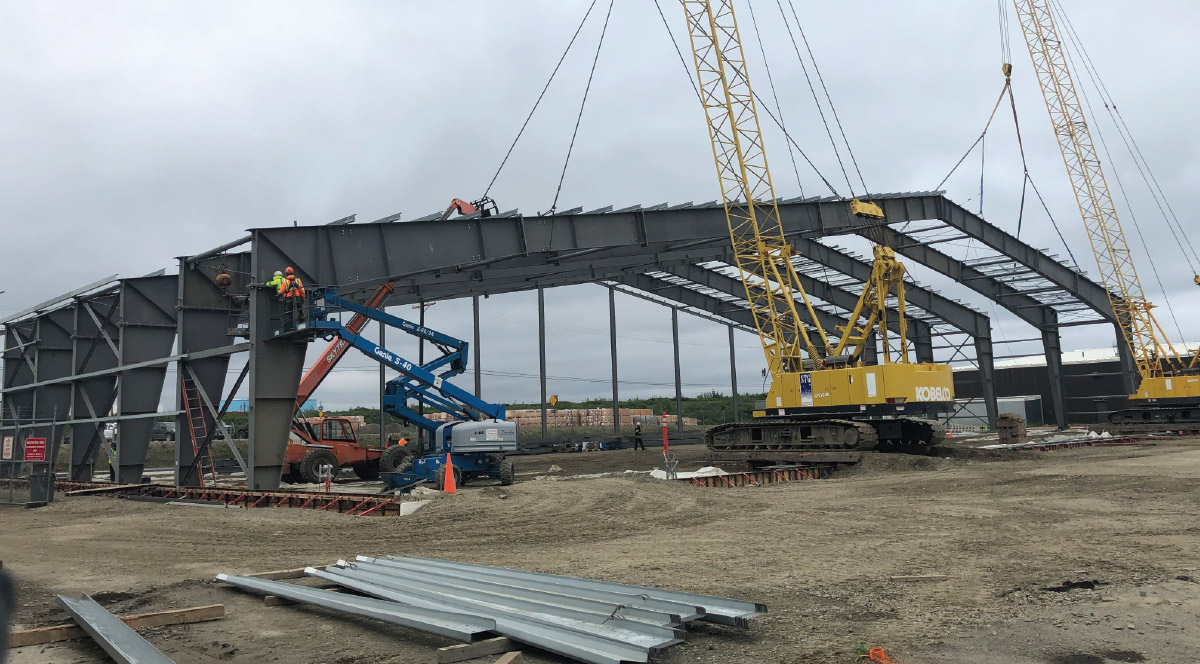Alaska Commercial Development Group crew erecting structural steel for the Bering Air hangar in Nome