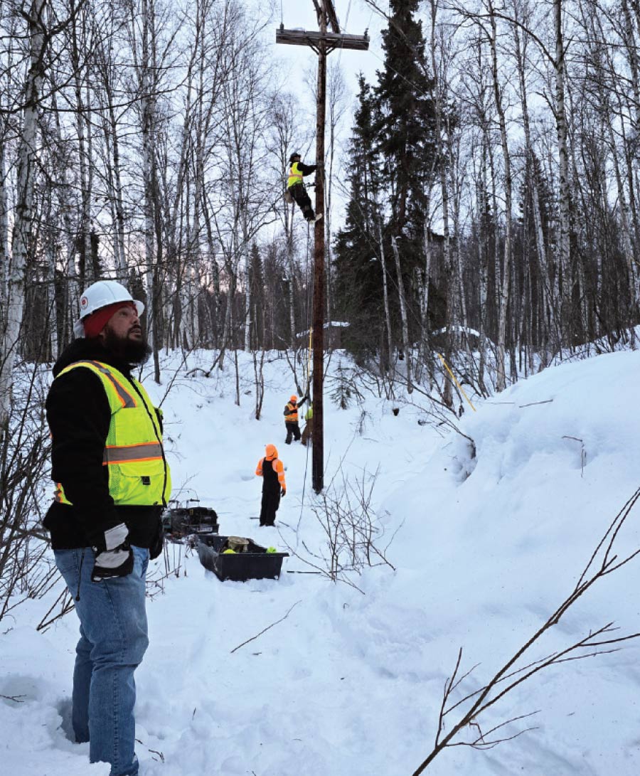 GCI workers observing power lines in snow