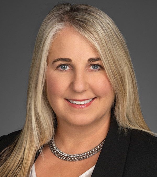Portrait orientation close-up headshot picture view of Annette Sheppard smiling