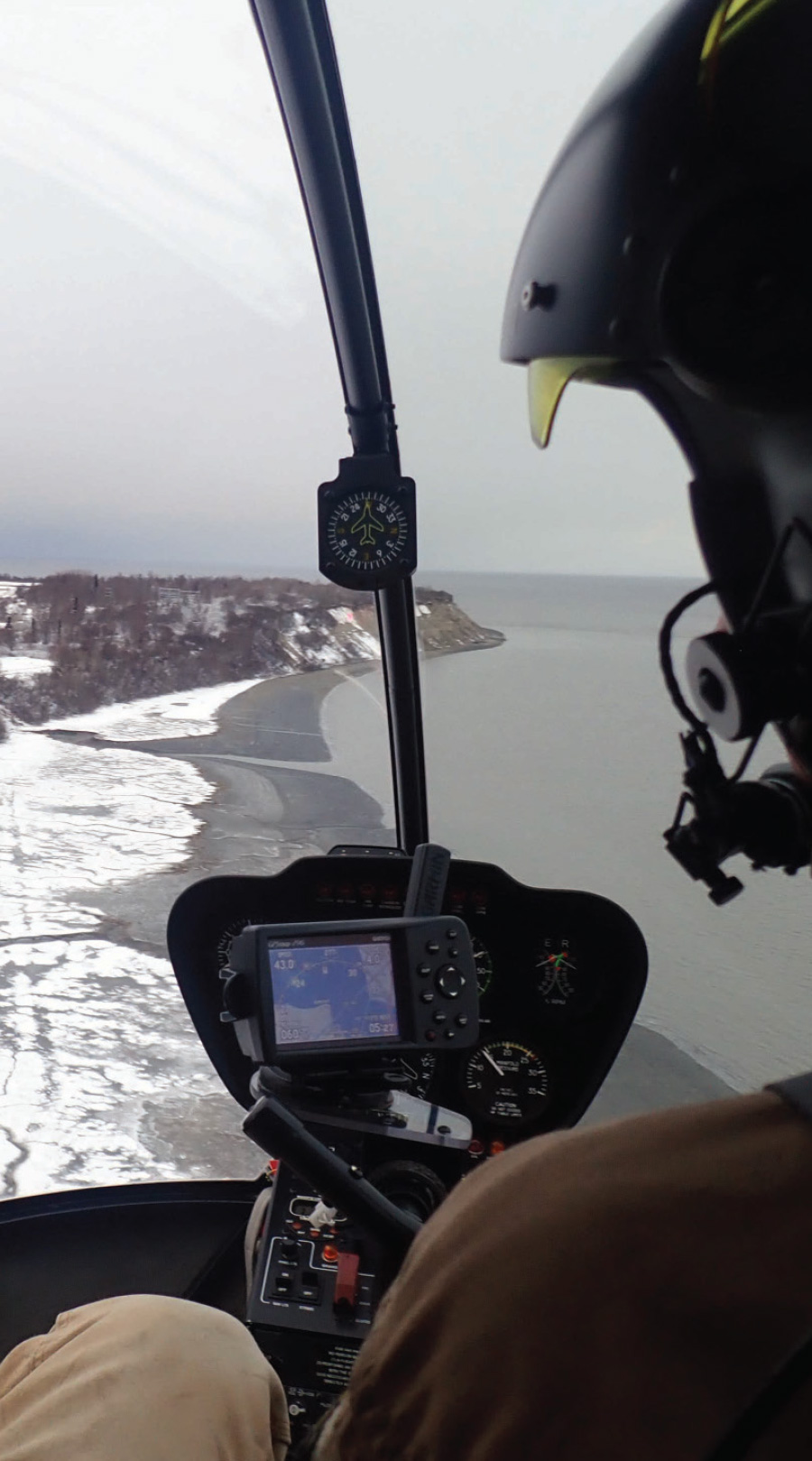 pilot doing aerial inspection of sand vents on the tidal flats near Earthquake Park in Anchorage