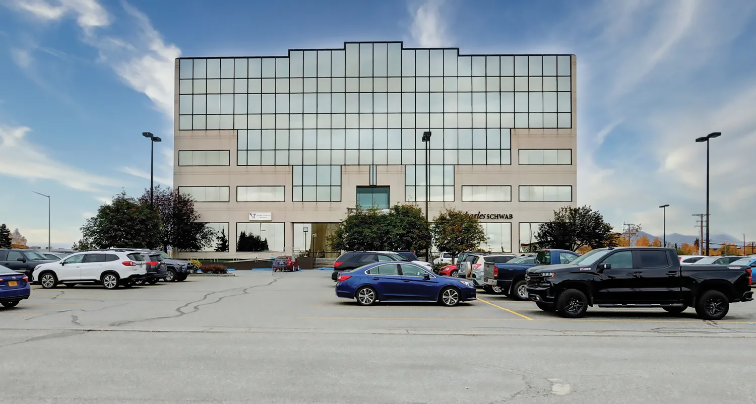 outdoor view of a commercial building from a parking lot
