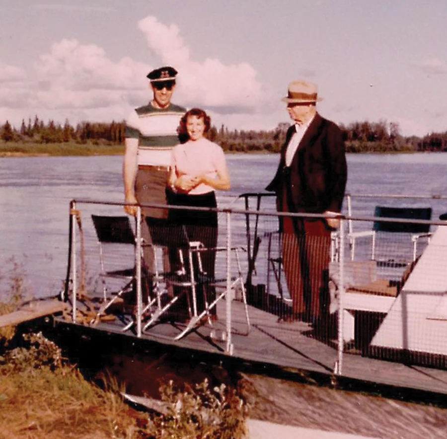 vintage photo of three people posing at the deck of a boat